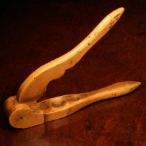 Nutcrackers - a 19th century boxwood lever-action nut cracker, with provision for two sizes of
