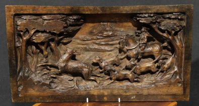 A 19th century Continental walnut rectangular panel, boldly carved in the Renaissance taste with a