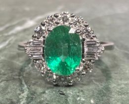 A certified emerald and diamond ring, central oval cut emerald, 1.46ct, surrounded by sixteen