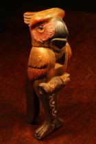Nut Crackers - a Black Forest novelty lever-action nut cracker, carved as a parrot, glass eyes,