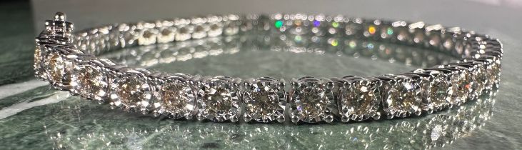 A diamond tennis bracelet, set with forty seven round brilliant cut diamonds, total estimated