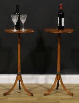 A pair of Sheraton Revival satinwood and painted urn or lamp tables, each with octagonal top,