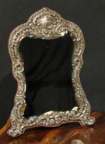 An Edwardian silver easel dressing table mirror, pierced and embossed with flowers and leafy