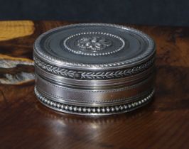 A French silver circular snuff or sweetmeat box, push-fitting cover centred by an acanthus boss, 4.