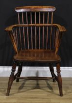 A 19th century beech, ash and elm Windsor elbow chair, 83cm high, 61cm wide, the seat 38cm wide