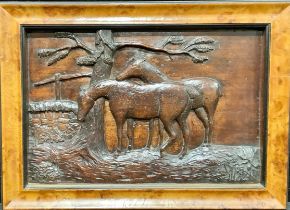 A 19th century mahogany primitive folk art panel, carved in relief with horses beside a tree, 27.5cm
