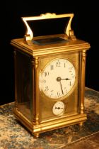 A late 19th century French gilt brass carriage alarm timepiece, 5cm enamel clock dial inscribed with