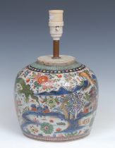 A Chinese ovoid doucai ginger jar, painted with a monumental landscape, clobbered in gilt, 20cm
