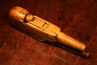 Nutcrackers - a 17th century boxwood figural lever-action nut cracker, carved with a primitive