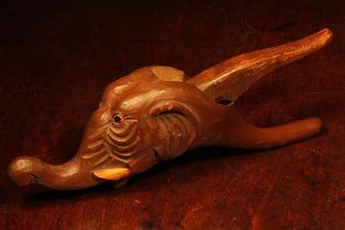 Nutcrackers - a Black Forest novelty lever-action nut cracker, carved as the head of an elephant,