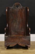 A George III oak lambing type child's rocking chair, possibly Welsh, shaped border, pierced cresting