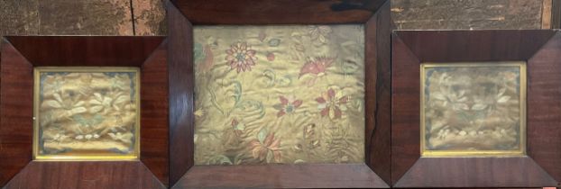 A pair of late 18th century needlework panels, embroidered in colourful silk threads with flowers