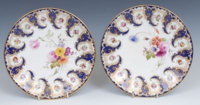 A pair of Royal Worcester circular plates, painted by Ernest Phillips, signed, with colourful summer