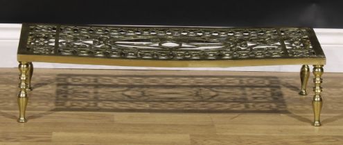 A 19th century brass fireside hearth trivet, 17.5cm high, 76cm wide, 32cm deep