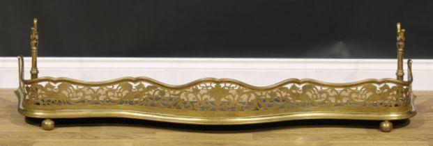 A 19th century brass serpentine country house fire curb or fender, pierced and engraved with Welsh