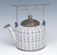A Chinese silver mounted tea or wine pot and cover, decorated overall with characters and verse,