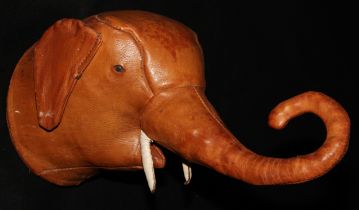 An early 20th century tan leather wall mask, in the manner of Liberty, as the head of an elephant,
