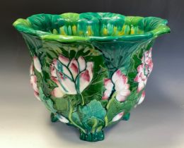 A Minton majolica jardiniere, moulded with water lilies and glazed in tones of green, pink and