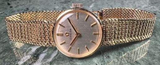 A lady's 9ct gold Omega watch, integral 9ct gold bracelet strap, 20g, boxed