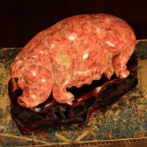 A Chinese hardstone carving, of a pig, the sow 15.5cm long, hardwood stand
