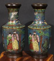 A pair of Chinese brown patinated bronze and champlevé enamel vases, decorated in polychrome with