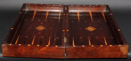 A 19th century rosewood and satinwood parquetry rectangular games box, opening to a board inlaid for