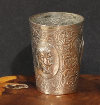 An unusual Victorian silver tapered cylindrical beaker, chased with profile portrait busts of