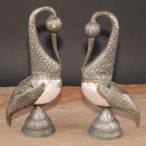 A pair of Tibetan/Nepalese silver coloured metal mounted pearl nautilus shell models, of birds,