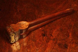 Nutcrackers - a 19th century rosewood lever-action nut cracker, brass spanner-form hinge, 23cm long