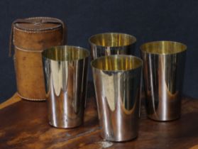 An Edwardian suite of four E.P.N.S nesting travelling hunting beakers, gilt interiors, 11cm high,