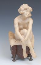 French School, early 20th century, a marble, Lost in Thought, female nude seated on a cushion, 35.