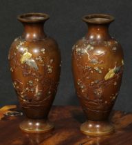 A pair of Japanese brown patinated bronze and mixed metal ovoid vases, inlaid and applied in