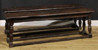 A pair of 18th century oak long benches or table-length joint stools, 51cm high, 160cm long, 31cm
