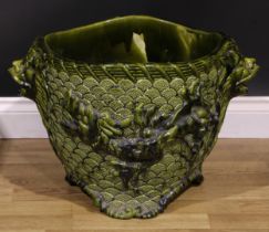 A substantial 19th century art pottery jardiniere, moulded in the Japanese taste with dragons,