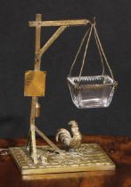 A 19th century French gilt bronze novelty nut dish, as a clear glass rectangular bowl suspended from