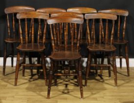 A set of eight Victorian beech and elm country kitchen chairs, each with a curved cresting rail