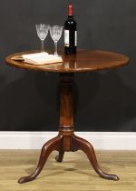 A George III mahogany tripod occasional table, one-piece circular tilting top, cannon barrel column,