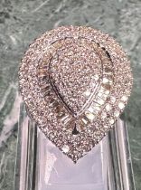 A large diamond teardrop cluster ring, pave set with baguette and round brilliant cut diamonds,