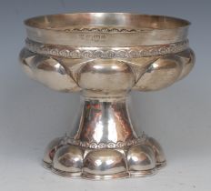 An Arts & Crafts silver fluted pedestal bowl, in the Medieval ecclesiastical taste, 12cm high,