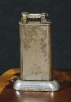 Dunhill - a mid-20th century E.P.N.S table cigarette lighter, engine turned, 10cm high