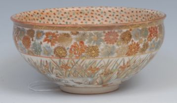 A Japanese Satsuma bowl, painted in the typical palette with fish in a meandering river, the