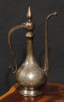 A Middle Eastern damascened steel ewer, chased in the Islamic taste with reserves of lotus and