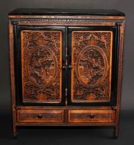 A Chinese sandalwood table cabinet, the doors pierced and carved in the Cantonese taste with figures