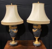 A pair of Louis XVI style gilt metal mounted marble table lamps, each applied with Bacchus masks and