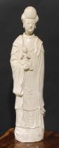 A large Chinese blanc de chine figure, of Guanyin, depicting as Goddess of Mercy, holding a child,