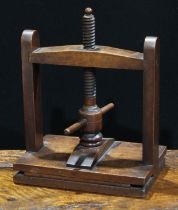 A 19th century mahogany table-top flower or book press, 34cm high, 26.5cm wide, 19cm deep