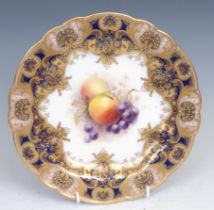 A Royal Worcester shaped circular plate, painted by William Ricketts, signed, with apples and