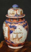 A Japanese ovoid jar and cover, painted in the Imari palette with cranes and flowers, 33cm high,