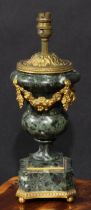 An early 20th century gilt metal mounted verde antico marble campana table lamp, applied with