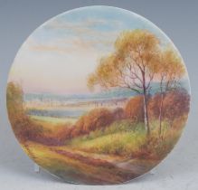 A Royal Worcester circular plaque, painted by R. Rushton, signed, with a view of Oxford from Boars